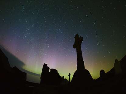 A dark sky filled with stars above the Ynys Enlli. 