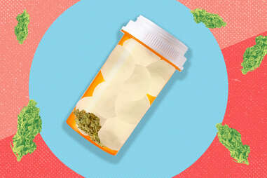 pill bottle filled with cotton balls and weed