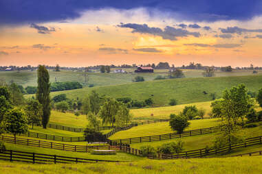 sun setting over a farm in Kentucky