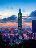 Taipei 101 is a landmark and the tallest building in Taiwan, shown at sunset