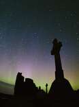 A dark sky filled with stars above the Ynys Enlli. 